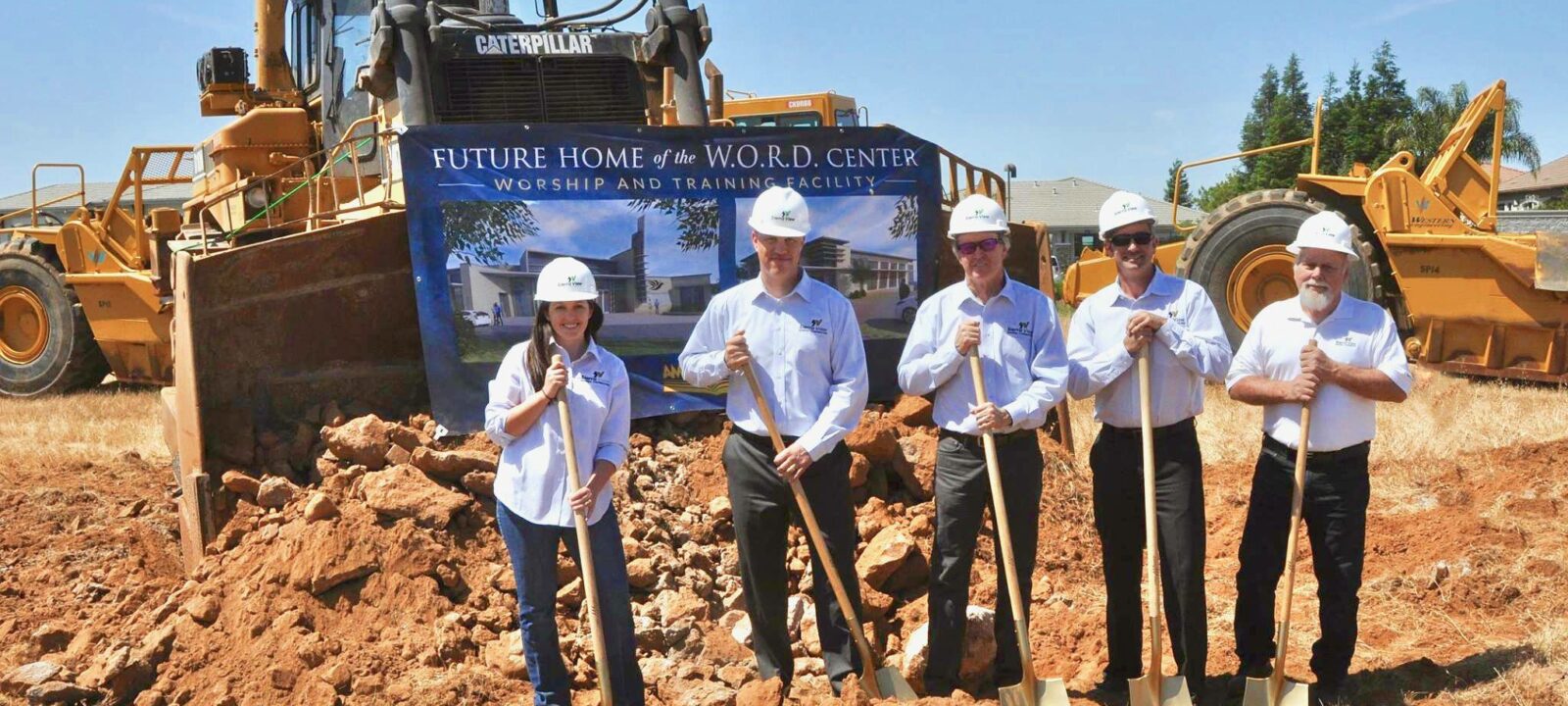 Sierra View team with shovels in field